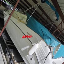 After photo of detailed boat side and cockpit under covered dock