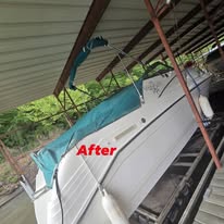 After photo of clean white boat side beneath covered dock